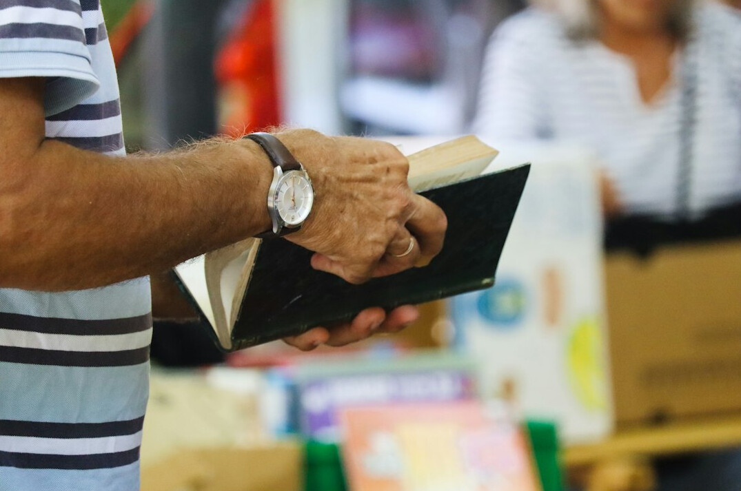 person turning book page